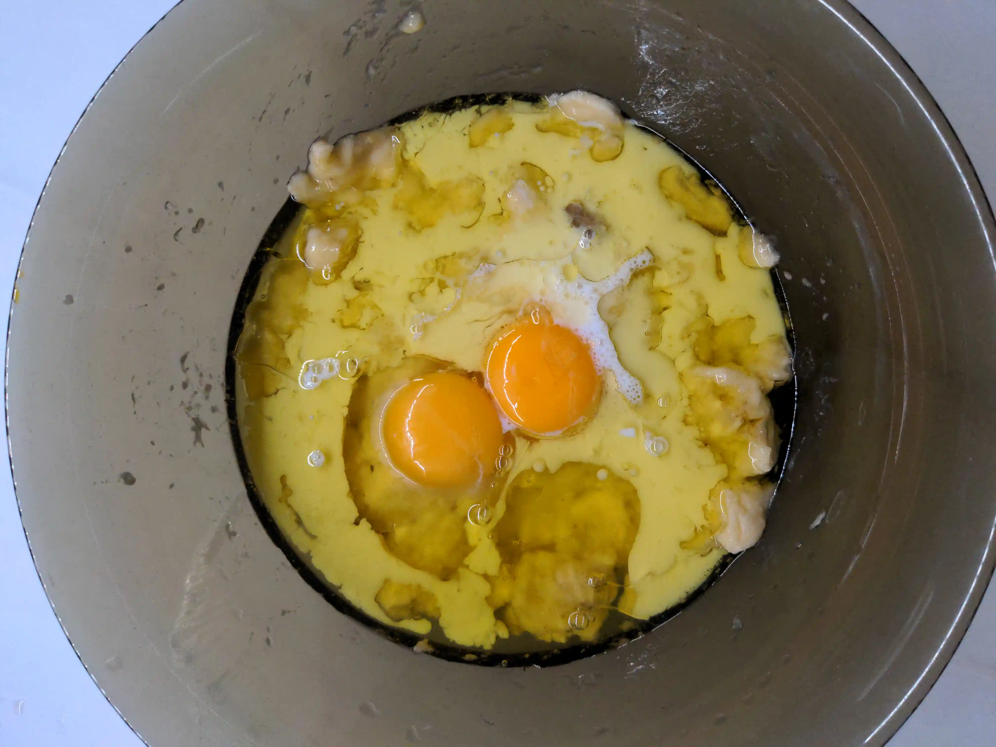 Wet ingredients added together to a bowl.